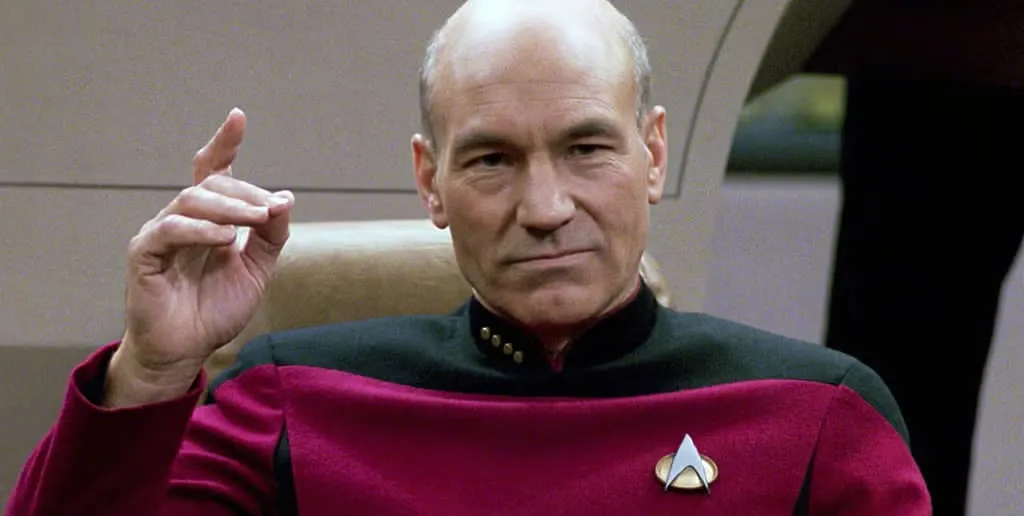 Patrick Stewart as Captain Jean-Luc Picard on the bridge of the Enterprise
