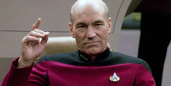 Patrick Stewart as Captain Jean-Luc Picard on the bridge of the Enterprise